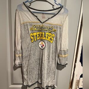 NFL Steelers lose fitting quarter sleeve grey shirts. Med but runs smalls big.